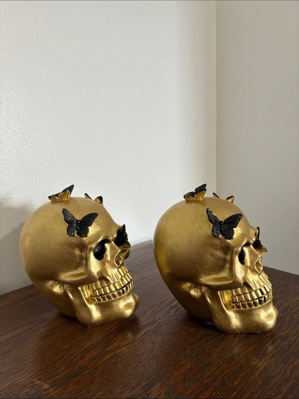 NWT- Set of 2- STUNNING- Gold Skull Statues with Black Butterflies Accents